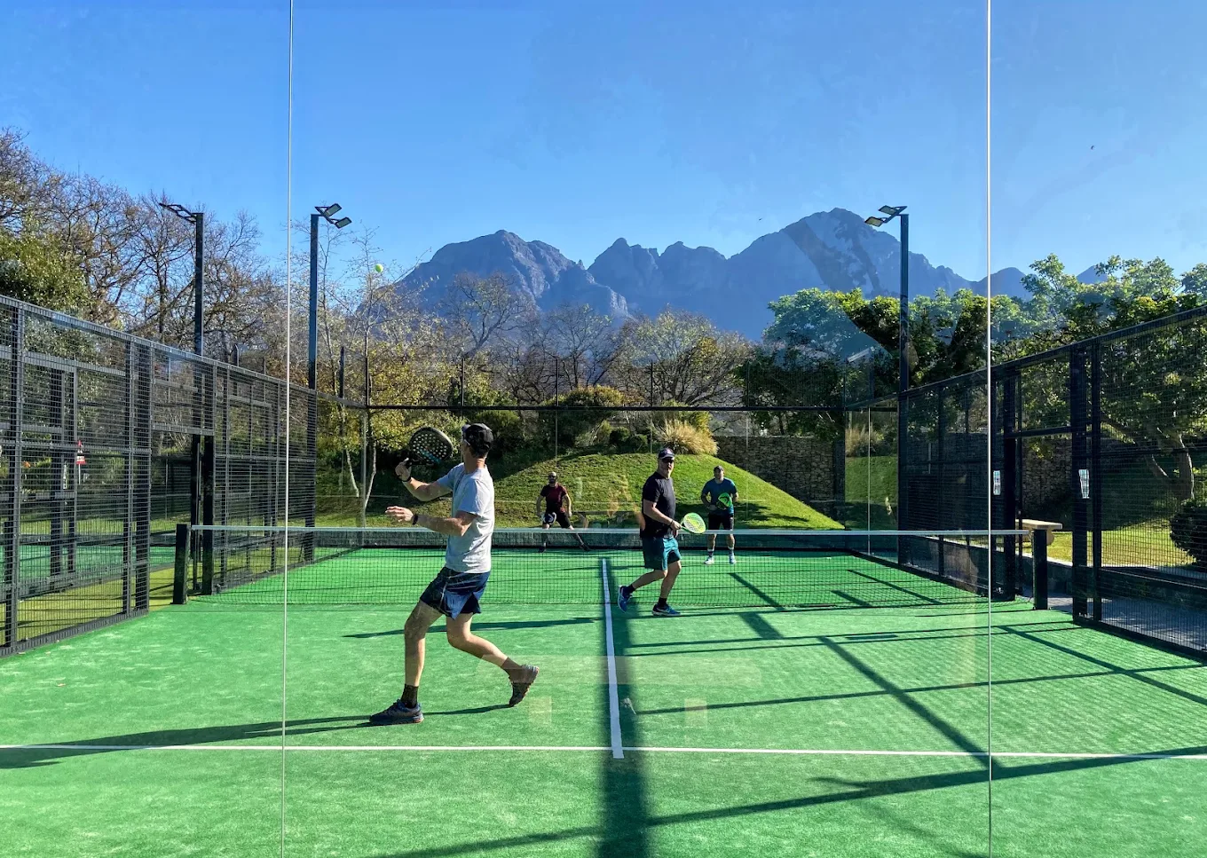Padel players in action on court at Virgin Active Padel Club Lourensford