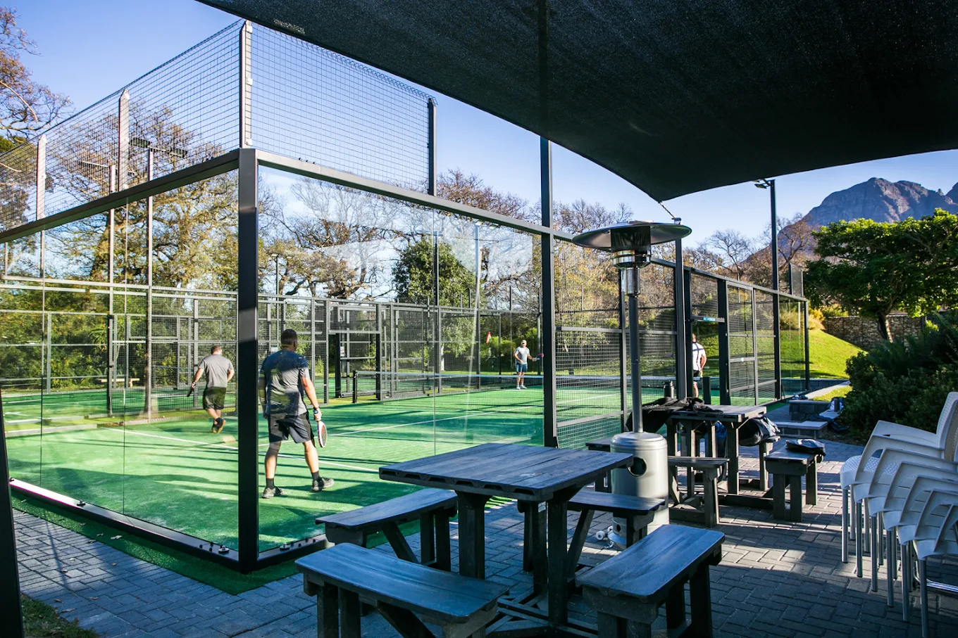 Covered padel courts and spectator seating at Virgin Active Padel Club Lourensford